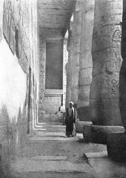 STOOD IN THE COLONNADE AT MEDINET HABU.